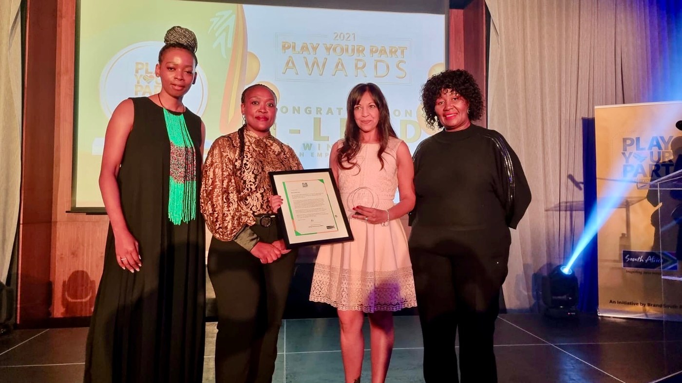 Risha Patak-Harie receiving the 2021 Brand SA Play Your Part Award
